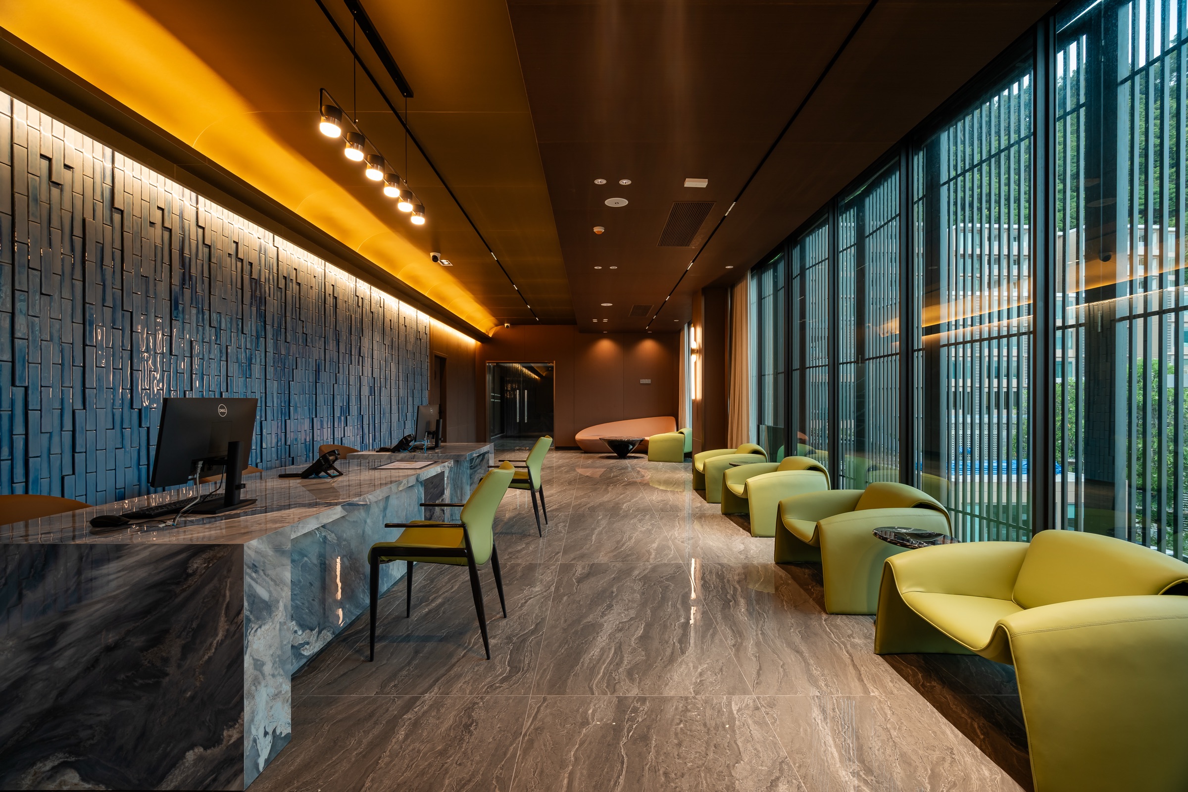 A refined hospitality lobby with custom furniture and warm lighting